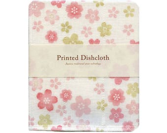 Könnte beinhalten: Ein weißer Geschirrtuch mit einem rosa und grünen Blumendruck. Das Geschirrtuch trägt den Text "Printed Dishcloth" und "Japanese traditional print technology".