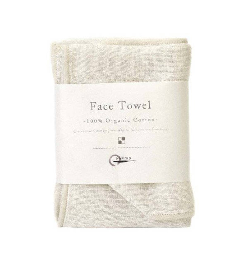 May include: A white organic cotton face towel with the text "Face Towel - 100% Organic Cotton - Environmentally friendly to human and nature" and a logo that says "Nawrap".