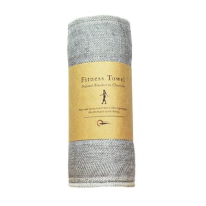 May include: A rolled up gray fitness towel with a brown label that reads "Fitness Towel - Natural Binchotan Charcoal - Anti-odor sports towel that is ultra lightweight, absorbent, and quick-drying."