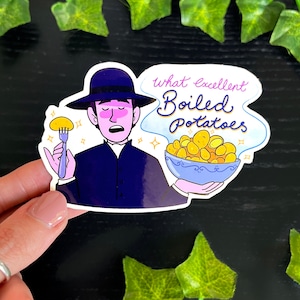 May include: A sticker with a cartoon illustration of a person in a dark blue suit and hat holding a fork with a potato and a bowl of potatoes. The text "what excellent Boiled Potatoes" is written in a cloud-shaped bubble.