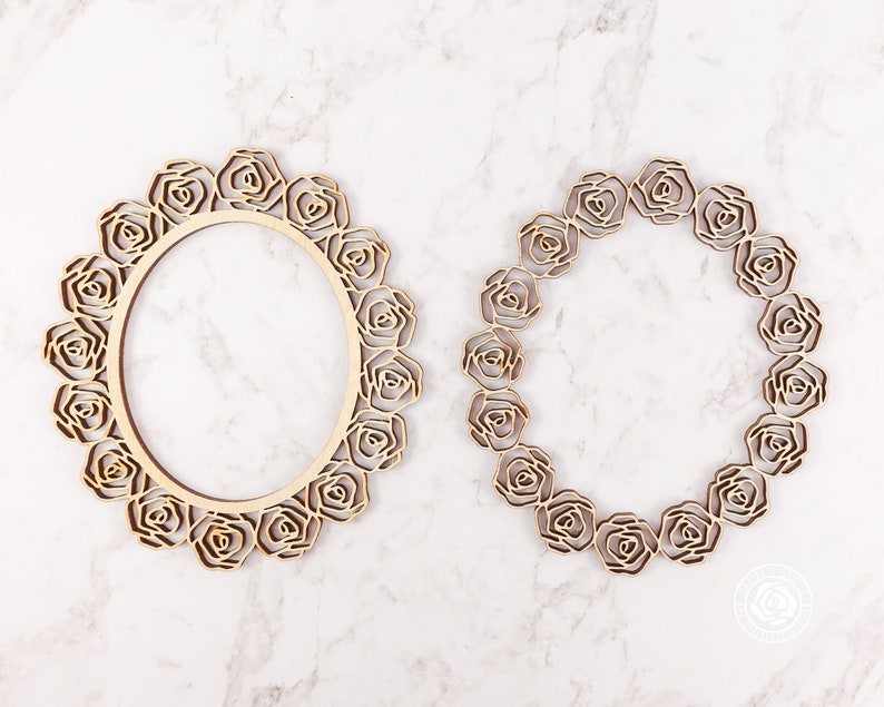 May include: Two wooden frames in the shape of a wreath of roses. The frames are unfinished and ready to be painted or stained.