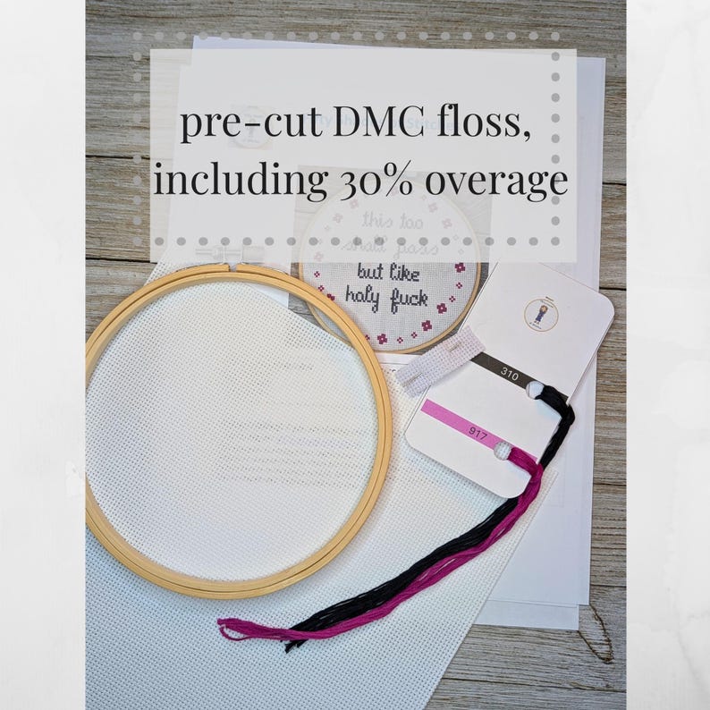 May include: A cross-stitch kit with pre-cut DMC floss, a wooden embroidery hoop, and Aida cloth. The kit includes two colors of floss: black and pink. The floss is labeled with the DMC numbers 310 and 917. The kit also includes a small card with the text "this too but like holy fuck".