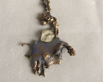 Pendant, bronze and stone