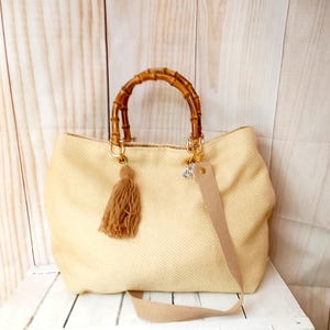 Beige cotton bag, with baboo handles and detachable shoulder strap , side tassel
