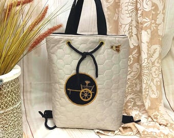Beige quilted velvet backpack with golden Sicilian cart patch – Handmade in Sicily