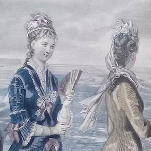 May include: Two women in 19th-century fashion stand on a pier overlooking the sea. The woman on the left wears a blue dress with a white lace collar and a pink ribbon. She holds a fan in her right hand. The woman on the right wears a yellow dress with a white lace collar and a white ribbon. She has a white scarf draped over her shoulders.