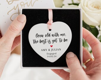 May include: White ceramic heart ornament with the text "Grow old with me, the best is yet to be" and the names "AMY & JULIAN" with the word "Engaged" and the date "14.02.24".