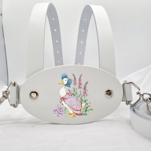 Cochecito de seguridad para niños pequeños de cuero italiano de lujo blanco con riendas para caminar en diseño de pato Puddle