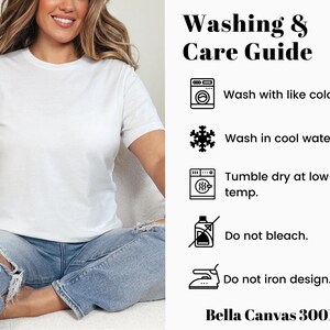 May include: Washing and care instructions for a white t-shirt. The instructions include washing with like colors, washing in cool water, tumble drying at low temperature, not bleaching, and not ironing the design. The text "Bella Canvas 3001" is also included.