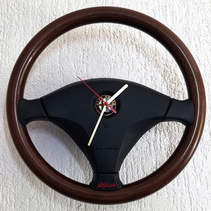 Wall clock &quot;Emozione&quot; – handcraft, original Alfa Romeo 156 car part, wooden rim – mahogany, black leather inserts, silent Quartz mechanism
