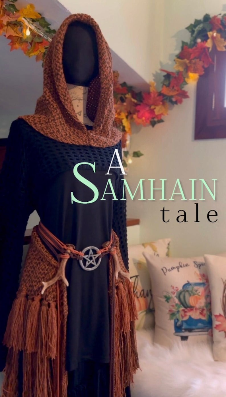 May include: A black hooded top with a brown crocheted shawl and fringe. The shawl is worn over a black top with a brown leather belt and a silver pentagram pendant. The text "A Samhain tale" is superimposed on the image.