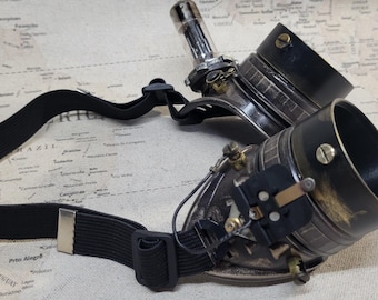 Aged Brown Steampunk Engineer Goggles With Extension Rings and a Vacuum Tube