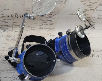 Gealterte Blaue Steampunk-Ingenieur-Brille mit Verlängerungsringen, Doppel-Lupen und einer Großen Lupe