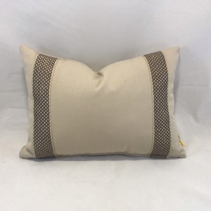 Oatmeal colour sturdy cotton cushion with woven flat braid trim