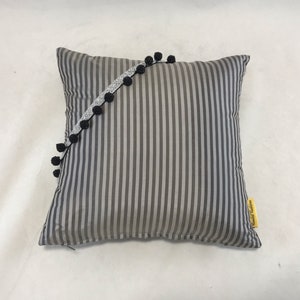On sale.Silk charcoal grey striped dainty cushion with bead ball/ silver lurex trim across front