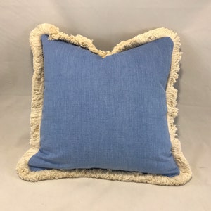Designer Guild Nara sky brushed cotton cushion with cut fringe braid