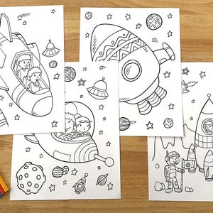 May include: Four black and white coloring pages featuring spaceships, astronauts, and planets. The pages are designed for children to color.