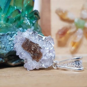 Amethyst stalactite slice set in 925 sterling silver.