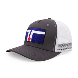 May include: A gray baseball cap with a white mesh back. The front features a rectangular patch with a blue background, white and red accents, and a maple leaf emblem.