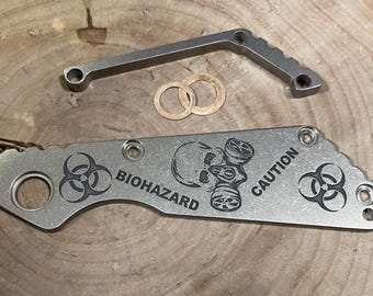 Handmade titanium set: spacer and scale with  "BIOHAZARD" design for Strider SNG.