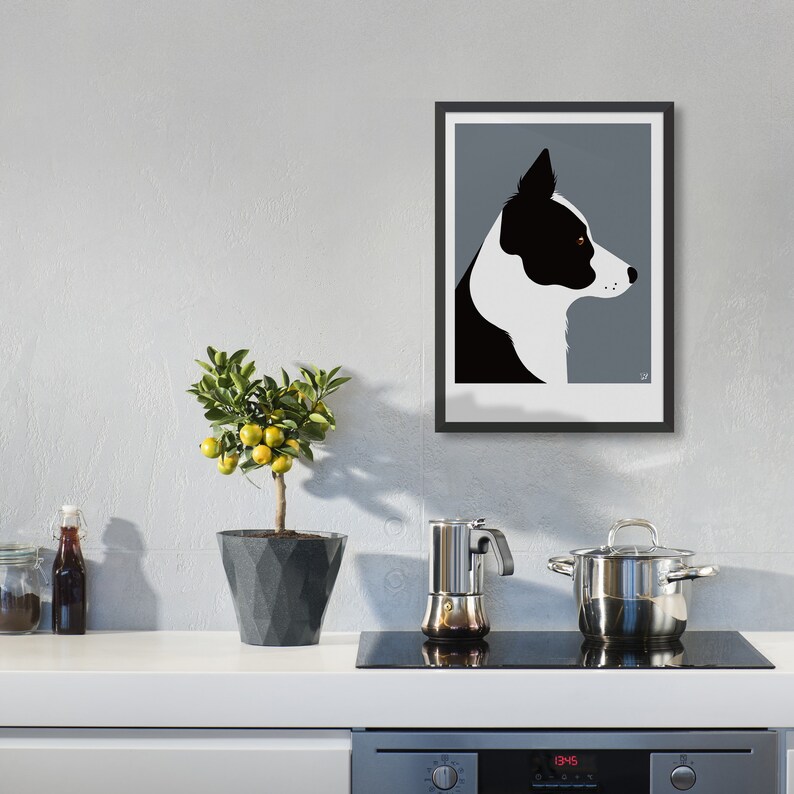May include: Black and white silhouette of a Border Collie dog's head against a gray background. The dog is looking to the right. The image is framed in black.