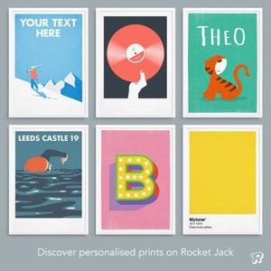 May include: Six framed wall art prints featuring various graphic designs: a skier with the text YOUR TEXT HERE, a red vinyl record, a tiger with the name THEO, a swimmer labeled LEEDS CASTLE 19, a letter B, and a yellow block with Mytone 10-1-1972.