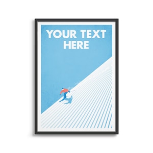 May include: Framed poster depicting a skier in a red jacket and blue trousers skiing down a snow-covered slope. The poster has a light blue sky background and white text that reads "YOUR TEXT HERE". The artwork is framed in a black frame.