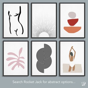 May include: A set of six framed wall art prints featuring diverse designs: a black ink torso outline, a sunburst line drawing, stacked geometric shapes in red and orange, a pink leaf silhouette, black concentric circles, and a figure in a white swimsuit.