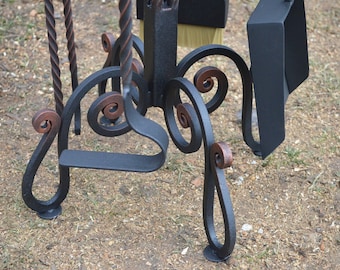 Wrought iron fireplace set. Wrought iron poker and scoop on a stand