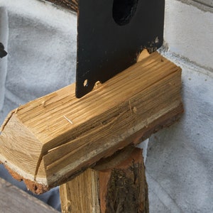 Wrought sconce in the form of an oak branch on which an owl sits with a lantern