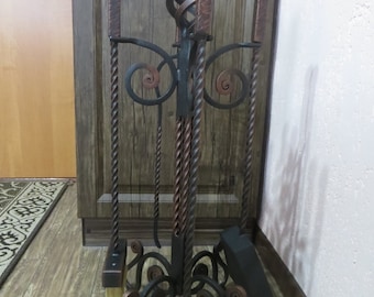 Wrought iron fireplace set. Wrought iron poker and scoop on a stand