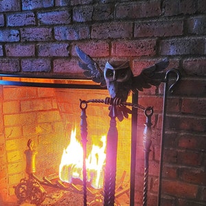 Wrought iron fireplace set. Wrought iron poker and scoop on a stand