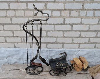 A set of fireplace tools and a stand for firewood, handmade