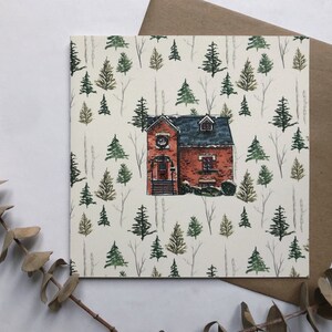 Carte de vœux des fêtes Maison et forêt