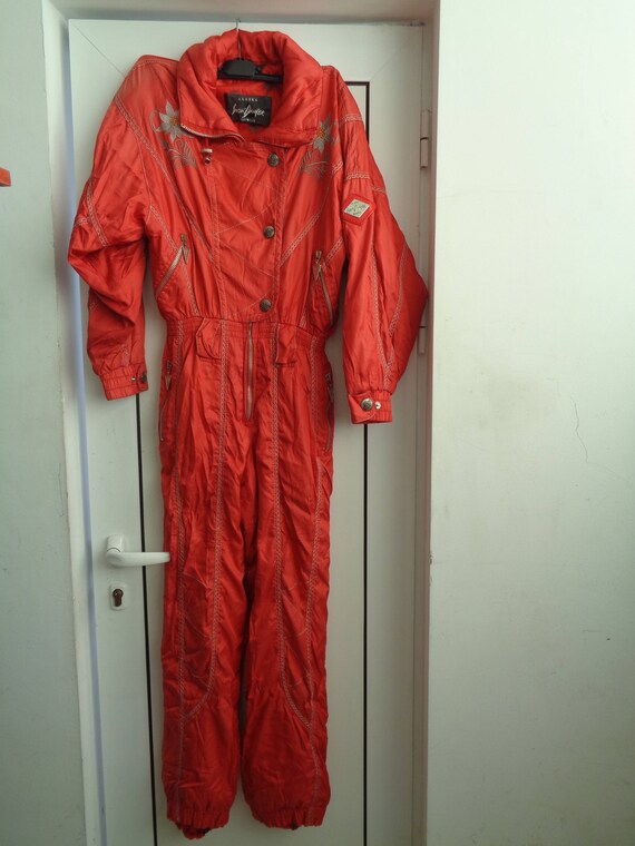 red one piece ski suit