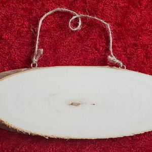 Wooden oval slice with bark hanging sign