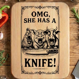 OMG, She Has a Knife! Funny Vintage Butcher Style Design | T-Shirt, Mug, Poster, Apron & Chopping Board | Dark Humor Kitchen Art SVG PNG Dxf