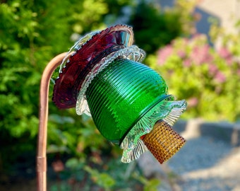 Floral garden art handmade from copper and vintage glassware in ruby red, Kelley green, amber and crystal clear