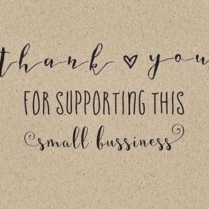 May include: A tan-colored card with black script that reads "Thank you" with a heart symbol, followed by "FOR SUPPORTING THIS small business."