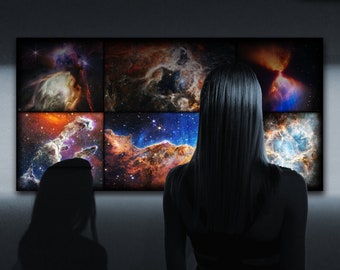 May include: Two people stand in front of a large screen displaying colourful images of nebulae in space. The screen is made up of nine individual screens.