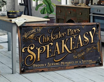 May include: A vintage-style wooden sign, featuring the words "Welcome to Chickadee Pines Speakeasy" in gold lettering. The sign has a dark, distressed background and a brown, aged frame. It reads "Proudly Serving Memories of a Lifetime."