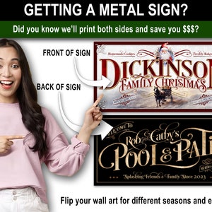 May include: A woman points to two metal signs. The front of the sign features a Christmas scene with the text "Dickinson Family Christmas". The back of the sign features a black background with gold text that reads "Welcome to Rob and Cathy's Pool & Patio".