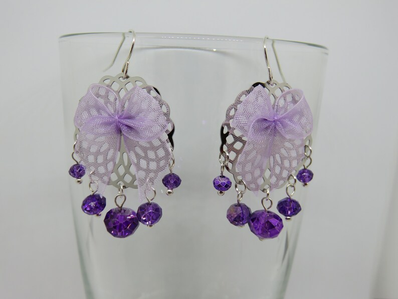 NYLIA silver print with faceted beads and a purple bow