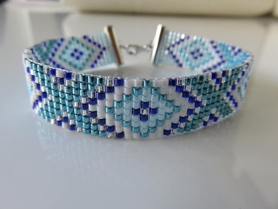 dark blue, light blue, white and satin gold Miyuki Delicas 110 hand-woven cuff bracelet