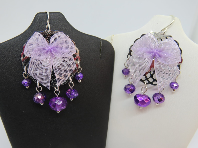 NYLIA silver print with faceted beads and a purple bow