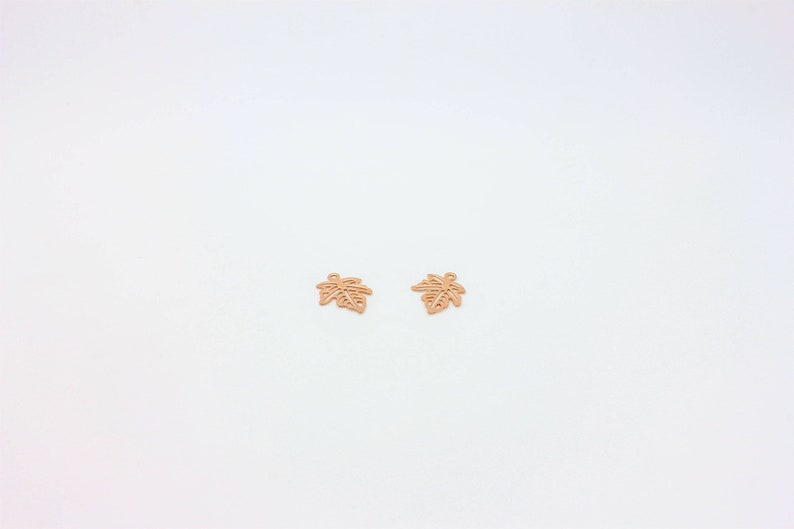 Tiny Rose Gold Maple Leaf Charm, Ideal for DIY earrings, necklaces, and bracelets, they add a timeless and sophisticated touch to any handmade creation.