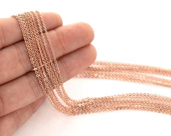 May include: A close-up of a bundle of rose gold chain, showing the delicate links and the shiny finish.