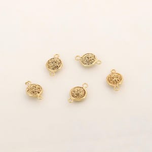 May include: Five gold-toned filigree metal connector charms with two jump rings on each charm.