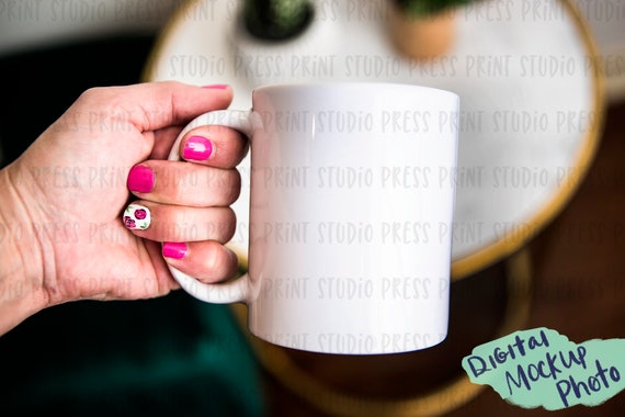 Download Mockup Photo Of White Coffee Mug With Hand Digital Amazing T Shirt Mockups Yellowimages Mockups