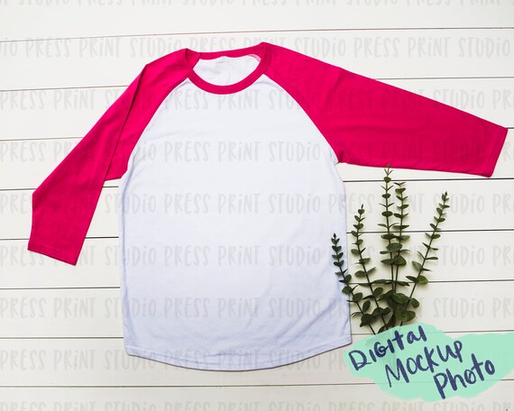 Mockup Photo Of Pink Baseball T-Shirt On Shiplap Digital Mockup Photo Of Pink Baseball T-Shirt On Shiplap Digital